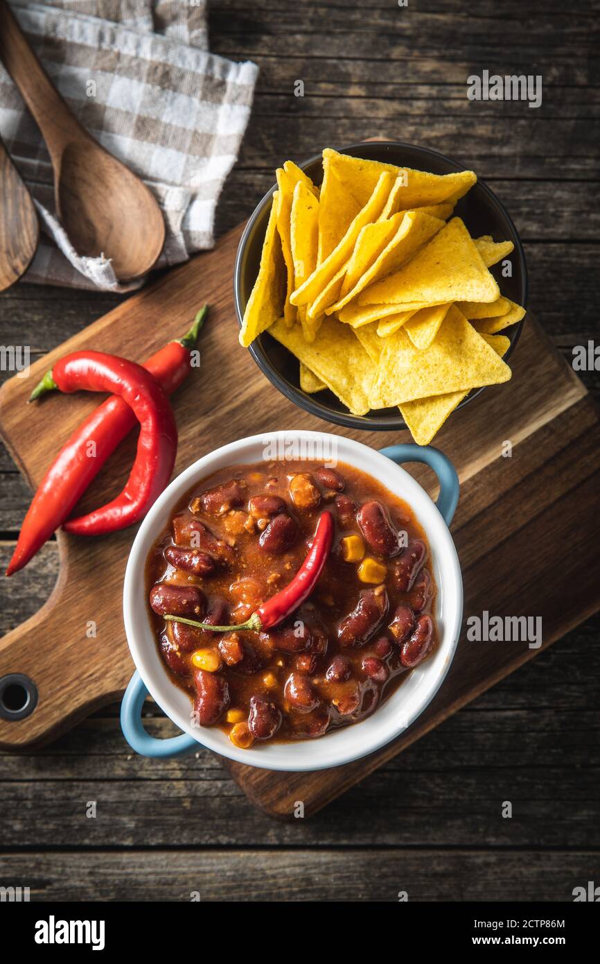 Chili con carne and tortilla chips. Mexican food with beans. Top view ... Chili con carne and tortilla chips. Mexican food with beans. Top view ...