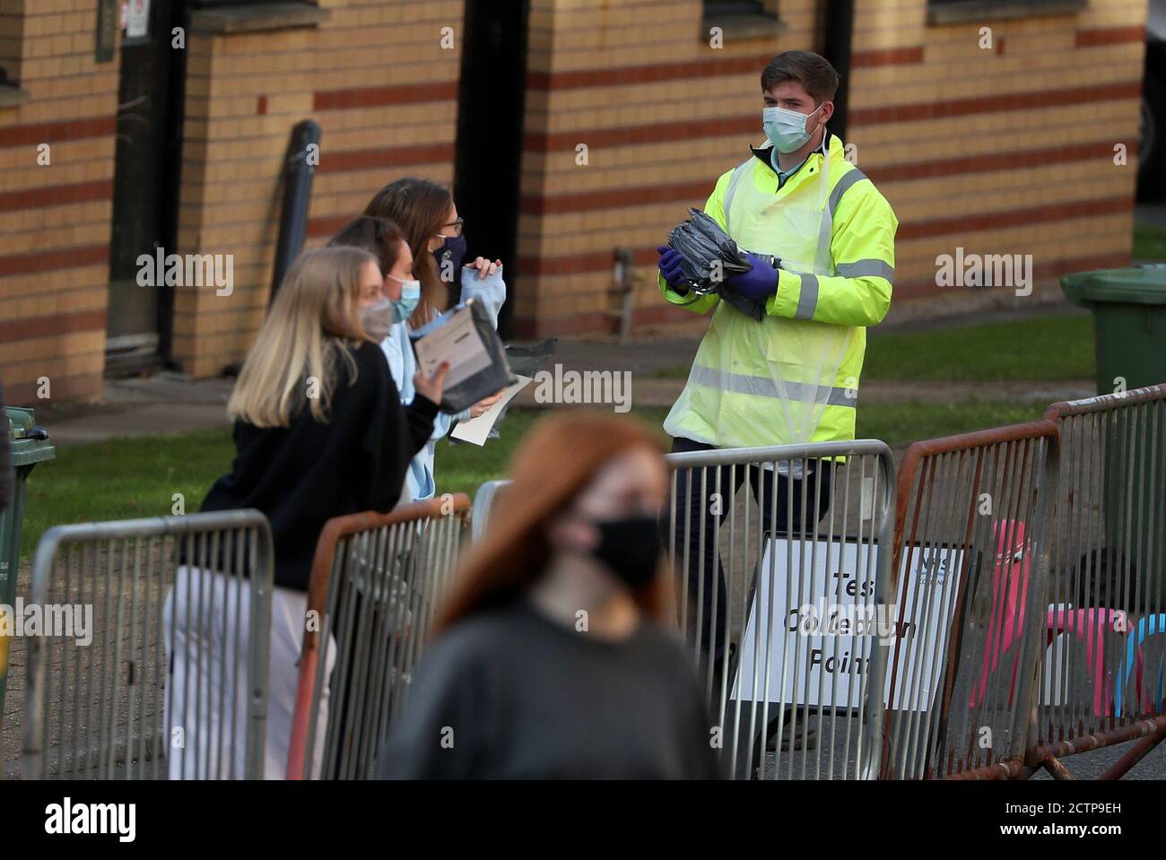 NHS staff carry test kits as Glasgow University students queue for