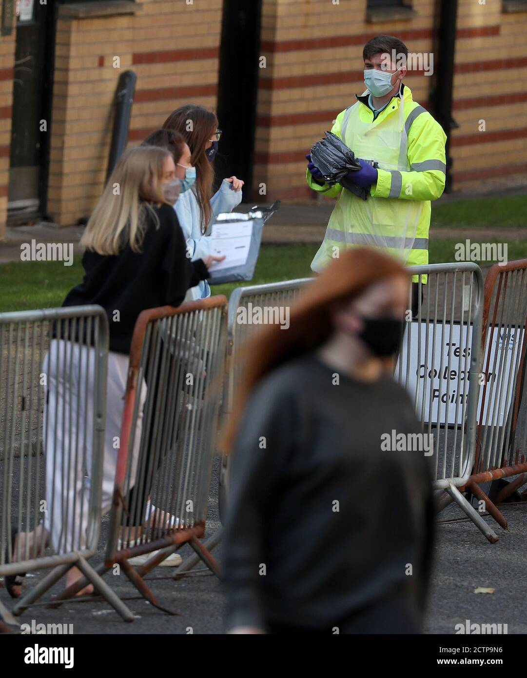 NHS staff carry test kits as Glasgow University students queue for