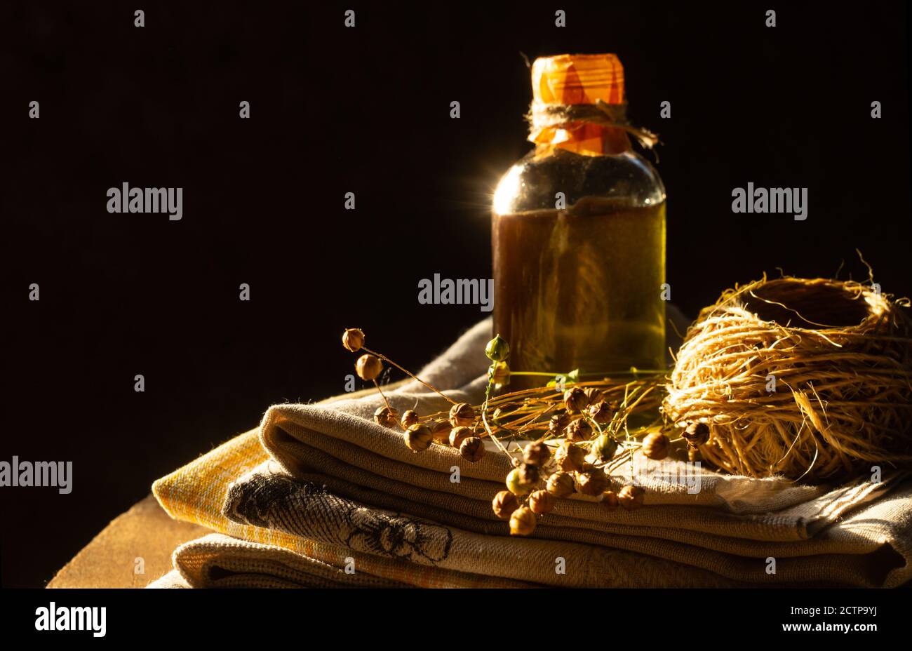 Linseed oil, linen cloth, rope, and dry flax plants. Retro style Stock ...