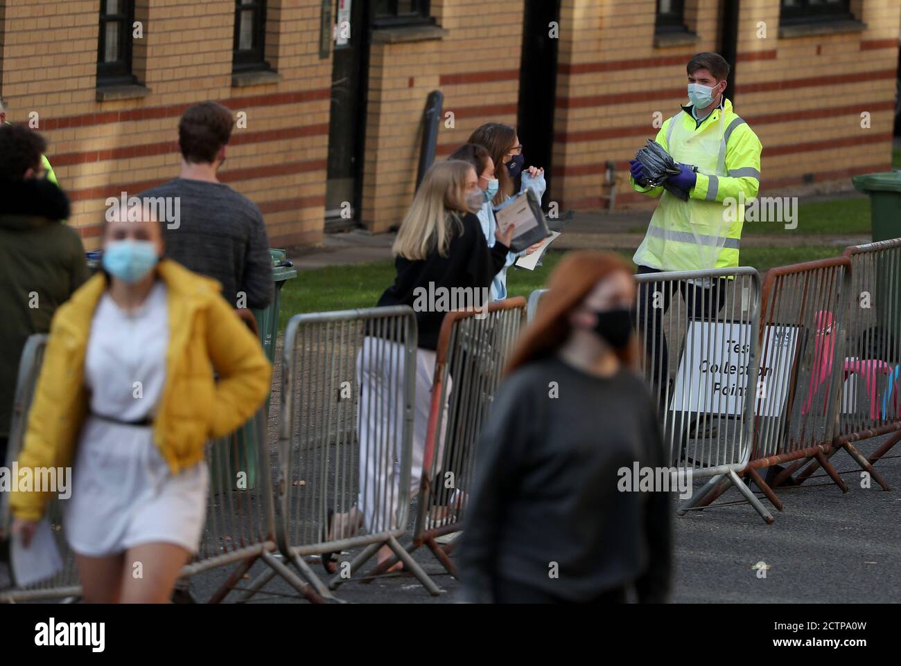 NHS staff carry test kits as Glasgow University students queue for