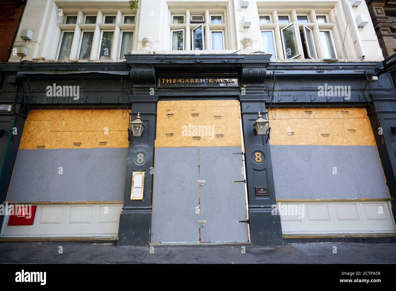 London, UK. - 20 Sept 2020: The boarded-up front of the Garick Arms pub on Charing Cross Road in central London. The Greene King pub has been shut since the start of the coronavirus pandemic. Stock Photo
