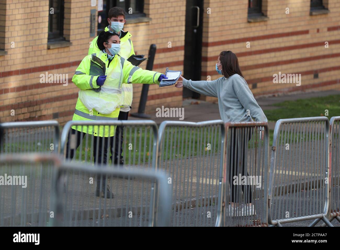 NHS staff hand out test kits to Glasgow University students as they