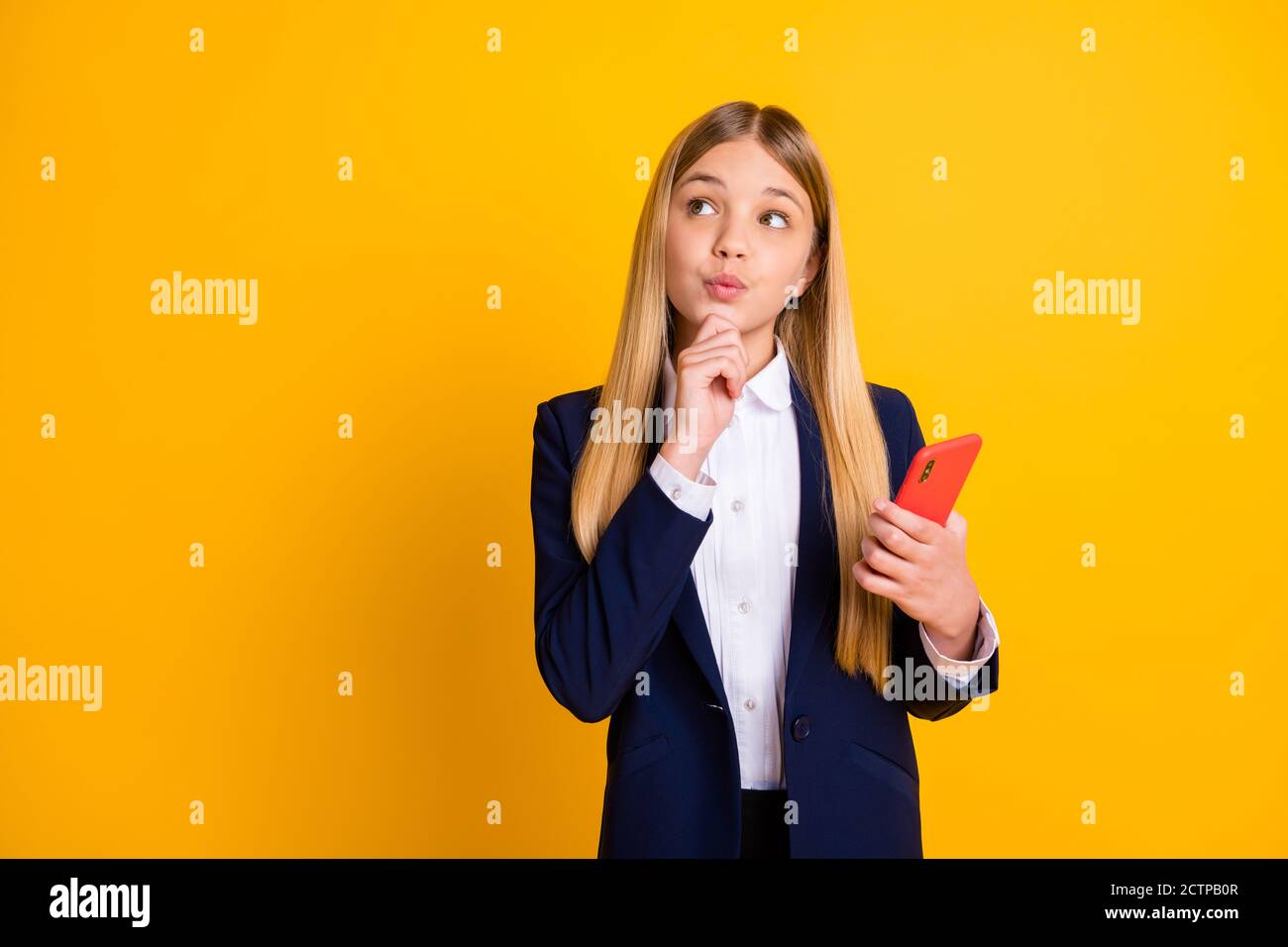 Portrait of her she nice attractive pretty creative cheery minded long-haired girl using cell creating new post chatting boyfriend isolated bright Stock Photo