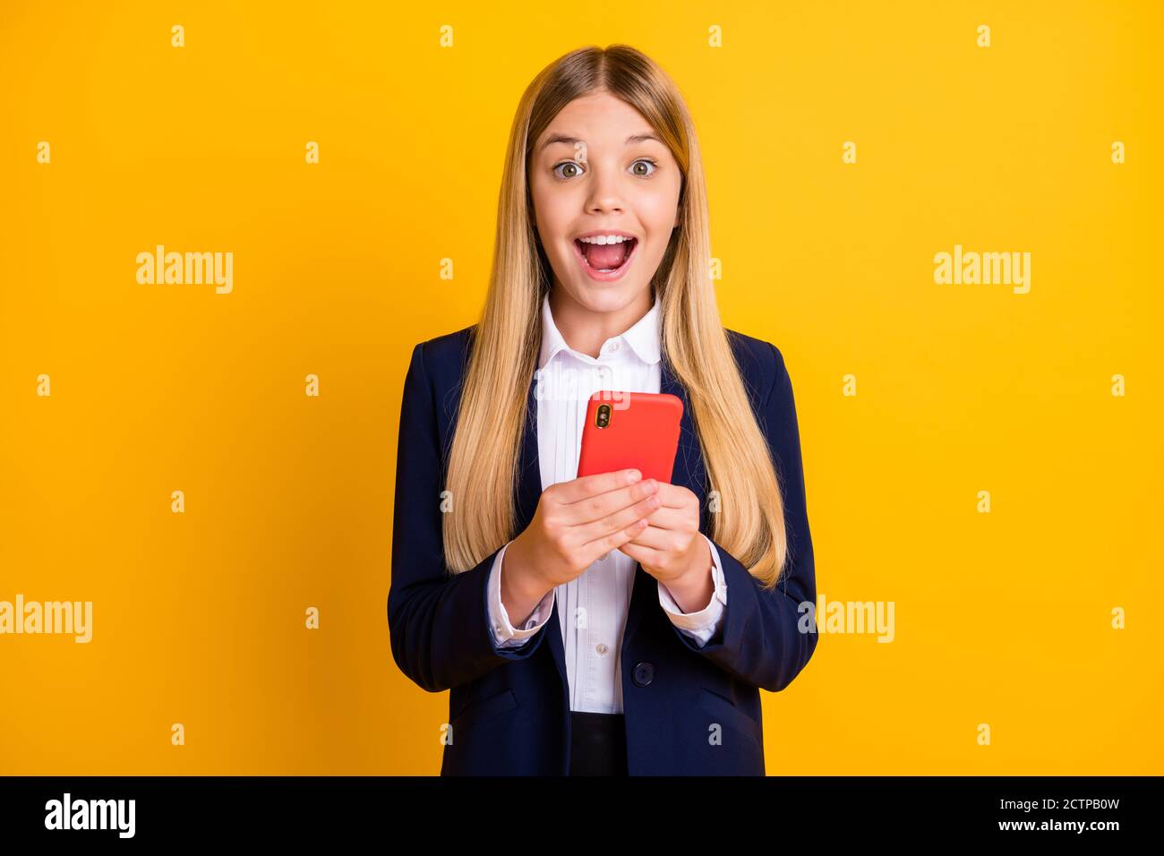 Portrait of her she nice attractive pretty glad excited cheerful cheery long-haired girl using device post feedback repost like reaction isolated Stock Photo
