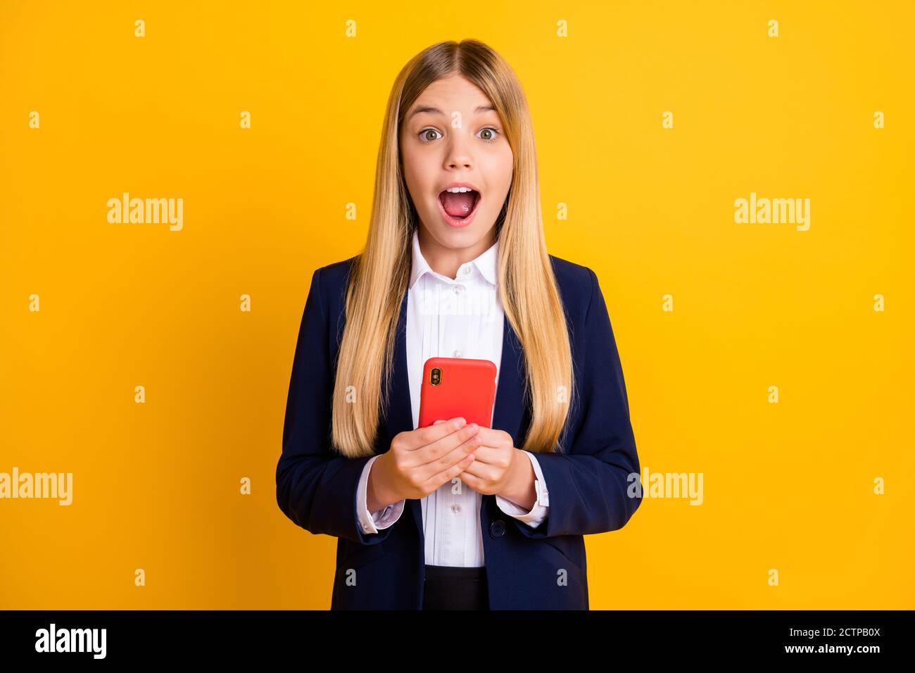 Portrait of her she nice attractive pretty amazed excited cheerful long-haired girl using device blogging post repost like reaction isolated bright Stock Photo