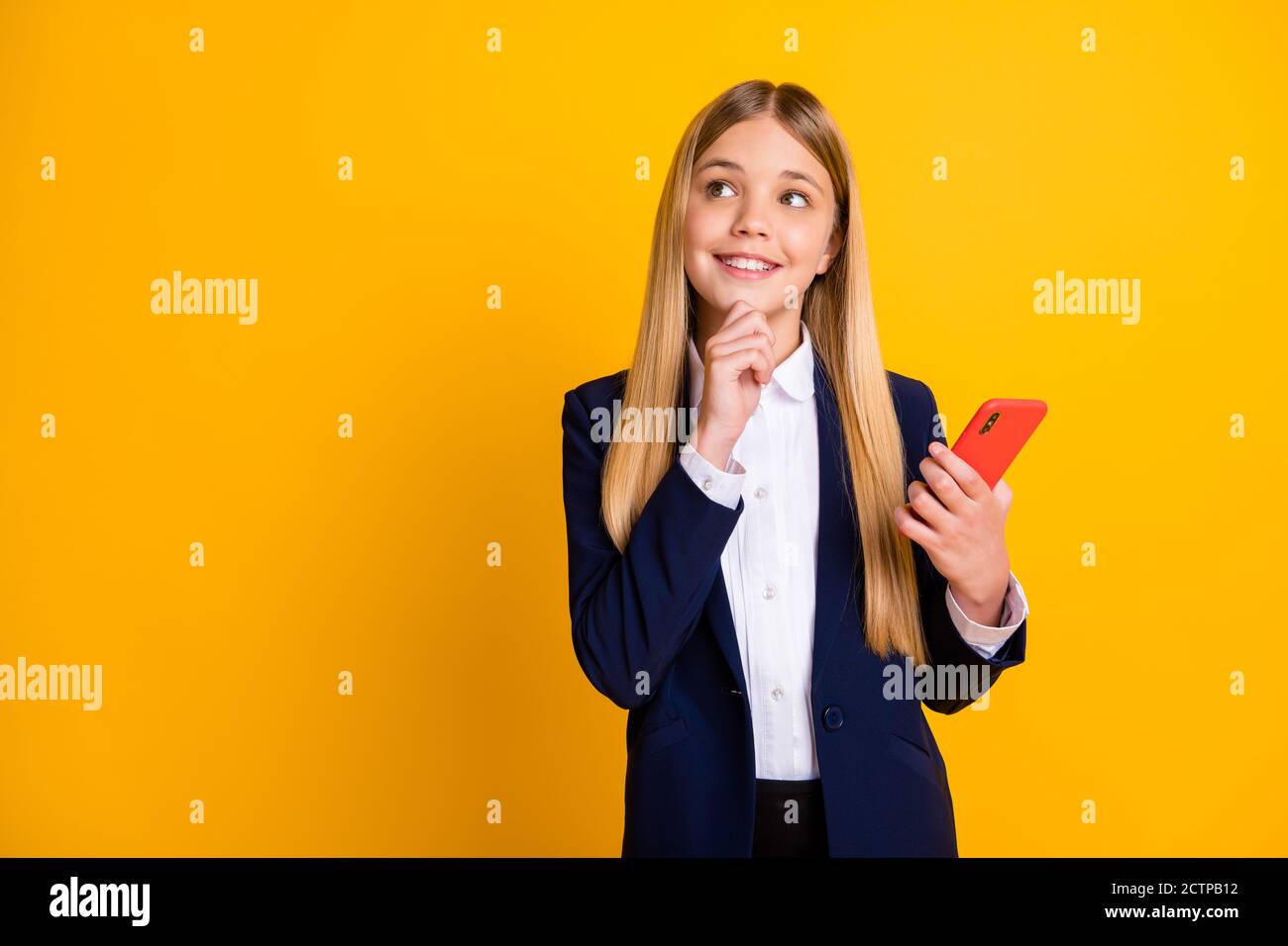 Portrait of her she nice attractive pretty creative cheerful long-haired girl using cell creating new post smm blogging app chatting isolated bright Stock Photo