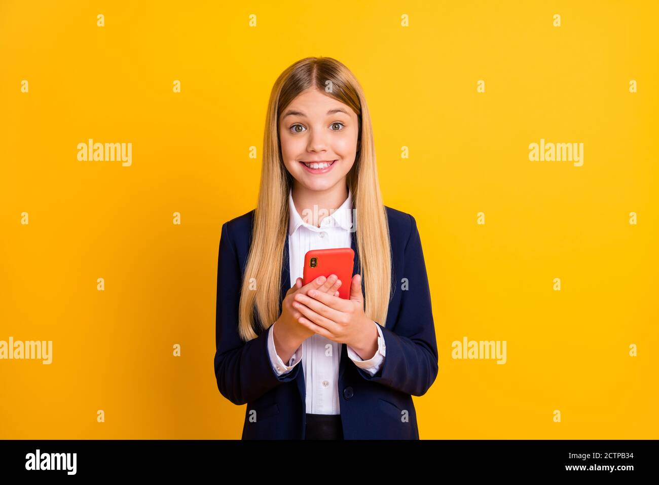 Portrait of her she nice attractive pretty cute funny lovely cheerful cheery long-haired girl using device smm media multimedia isolated bright vivid Stock Photo