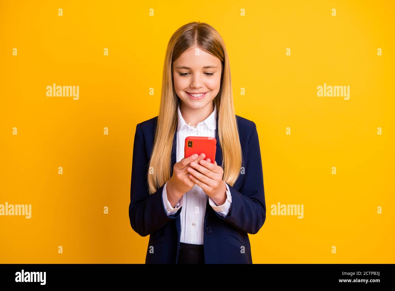 Portrait of her she nice attractive pretty lovely cheerful focused long-haired girl using gadget wi-fi app repost isolated bright vivid shine vibrant Stock Photo