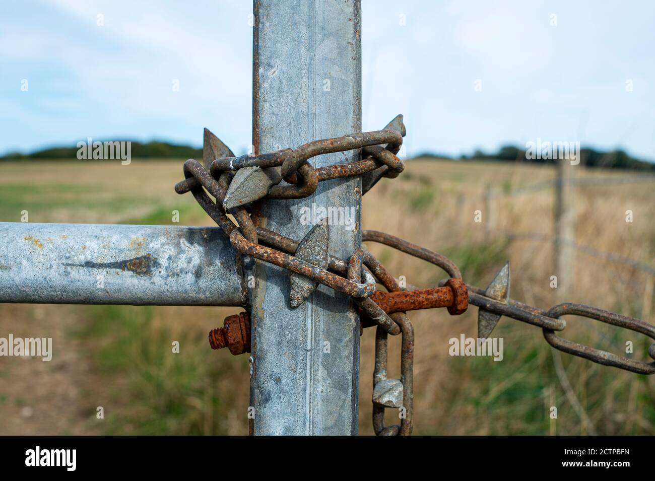 metal chain on a gate, keep out Stock Photo Alamy