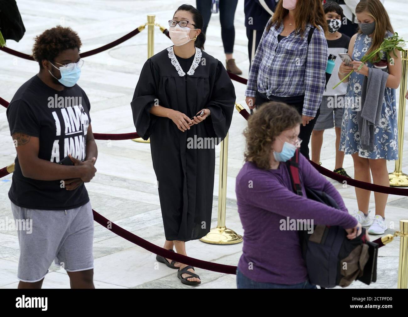 Washington, United States. 24th Sep, 2020. Mourners pay respects as Justice Ruth Bader Ginsburg lies in repose under the Portico at the top of the front steps of the U.S. Supreme Court building on Thursday, September 24 2020, in Washington, DC. Ginsburg, 87, died of cancer on Sept. 18. Pool photo by Andrew Harnik/UPI Credit: UPI/Alamy Live News Stock Photo