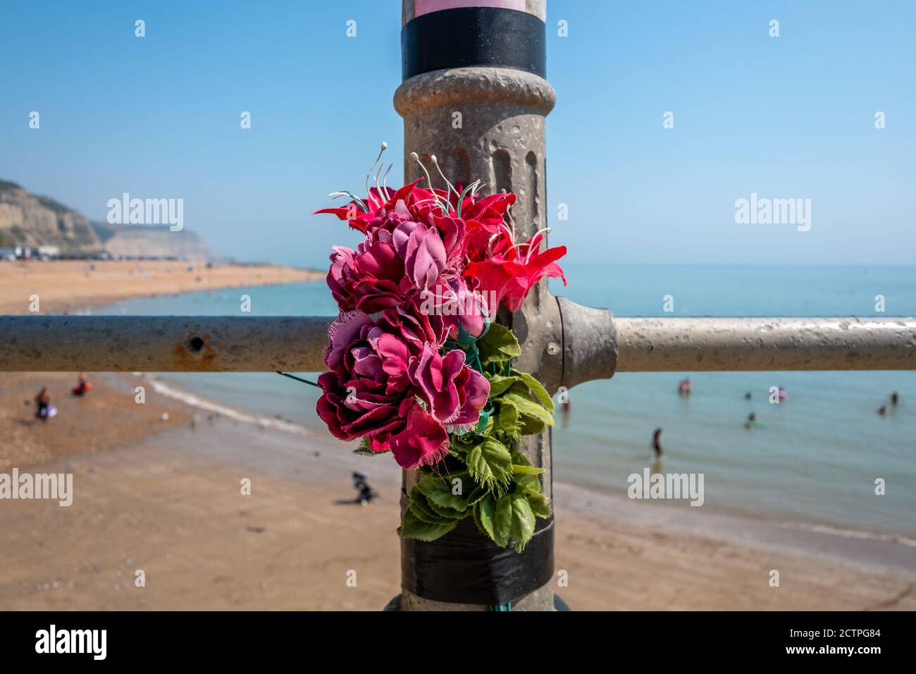 Memorial flowers on the seafront at Hastings Stock Photo