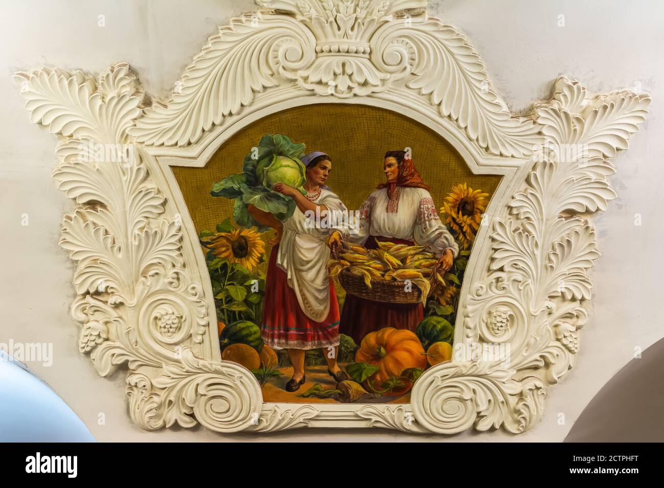 Moscow, Russia – July 8, 2017. Frescoed  panel depicting female farmers with vegetables at Kiyevskaya underground metro station in Moscow. The fresco Stock Photo