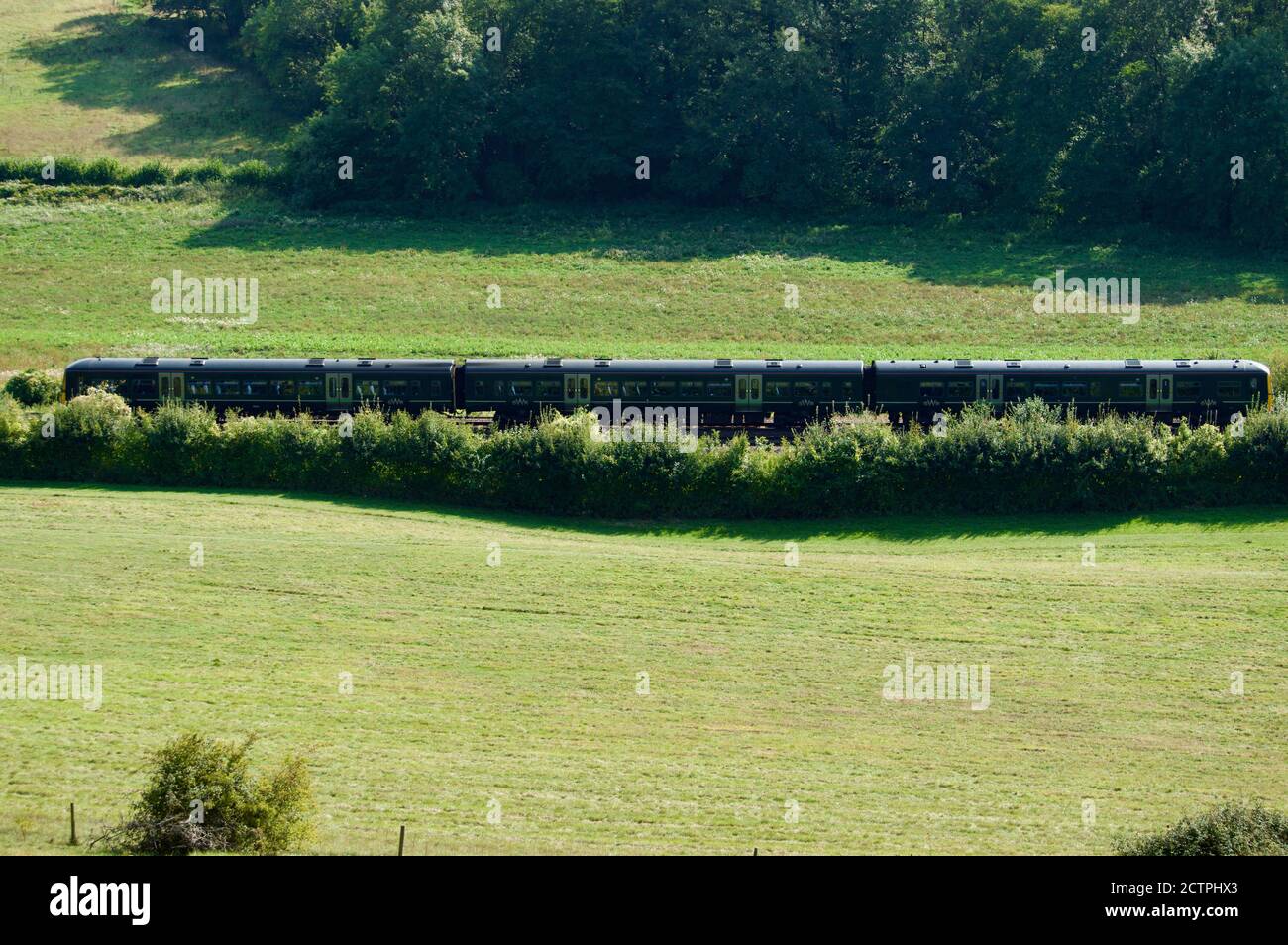 A Great Western Railway train going through the Surrey countryside in the UK Stock Photo