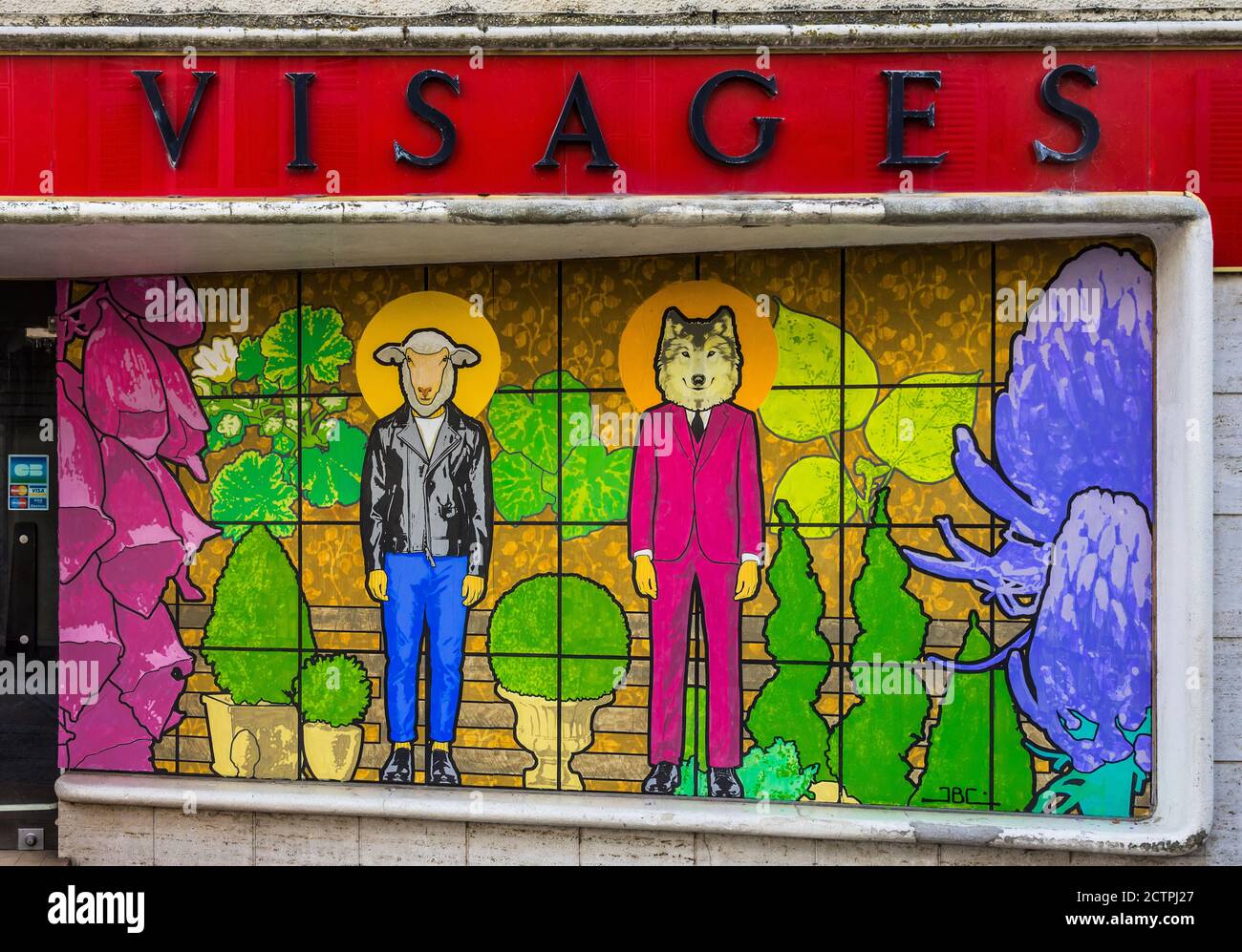 Commissioned artworks featuring sheep painted on closed shop windows on the Rue du Coq, Bellac, Haute-Vienne (87), France. Stock Photo