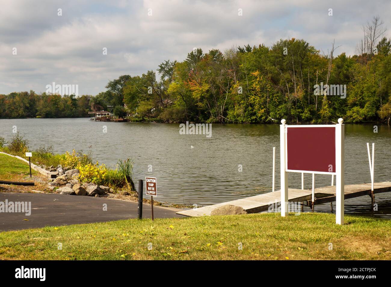 Dock and boat launch on the Seneca River in autumn Stock Photo Alamy