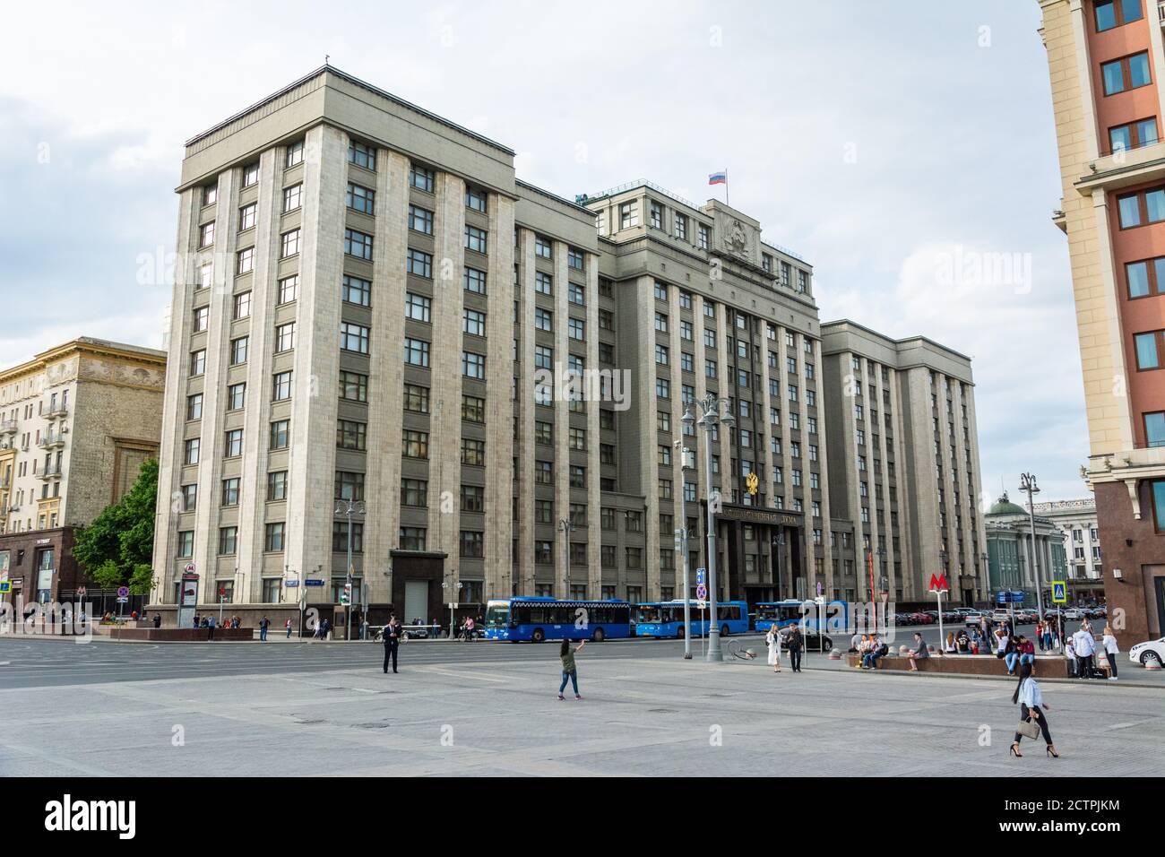 Moscow, Russia – June 8, 2017. Exterior view of the State Duma building at 1 Okhotny Ryad Street in Moscow, with people and cars. Stock Photo