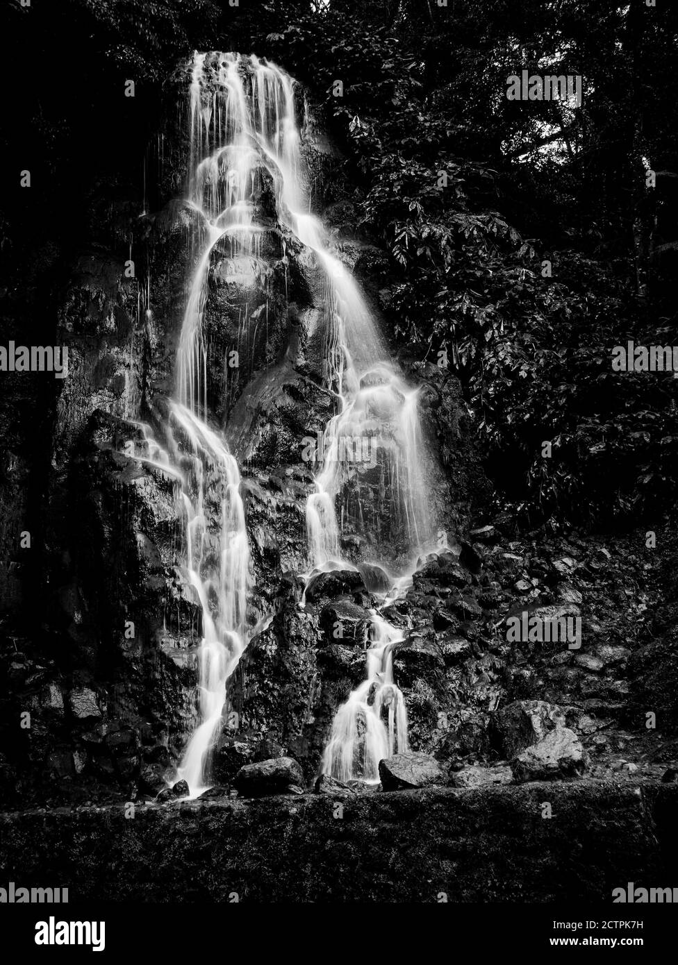 Black and White long exposure picture of Veu da Noiva waterfall, Sao Miguel island, Azores, Portugal. Stock Photo