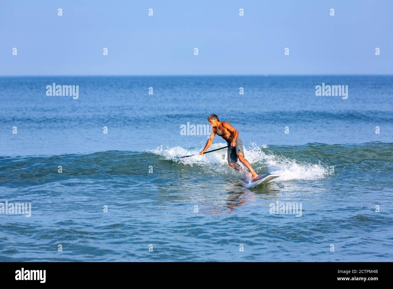 Paddleboarding in Marconi Beach, Eastham, Cape Cod National Seashore, Massachusetts,  United States Stock Photo