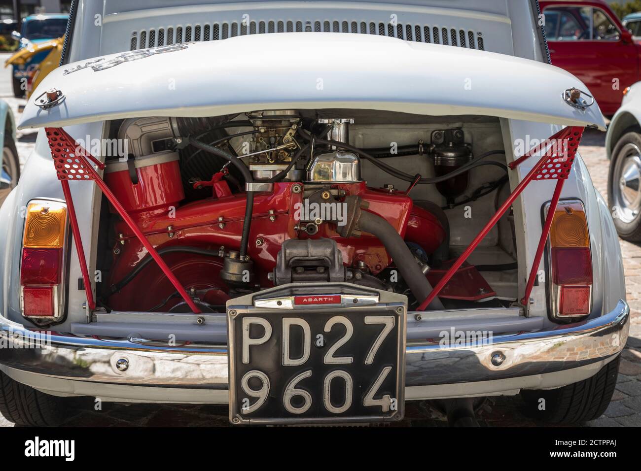 Close-up of the Abarth engine of a vintage Fiat 500 car, one of many on a  rally in the village square of Selva Val Gardena, Italy Stock Photo - Alamy