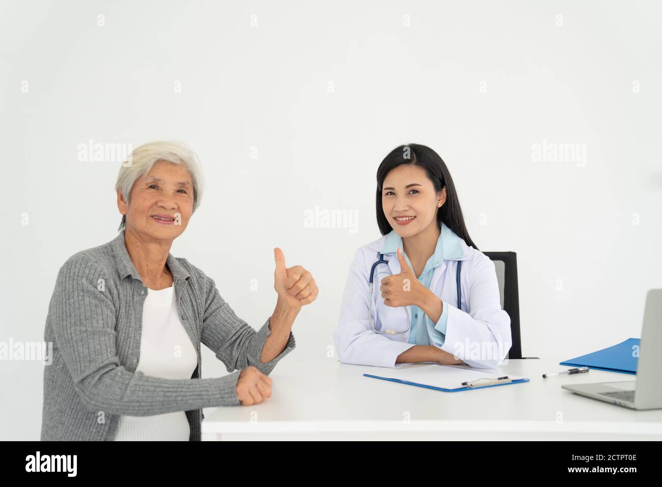 Health Visitor And A Senior Woman During Home Visit Stock Photo Alamy