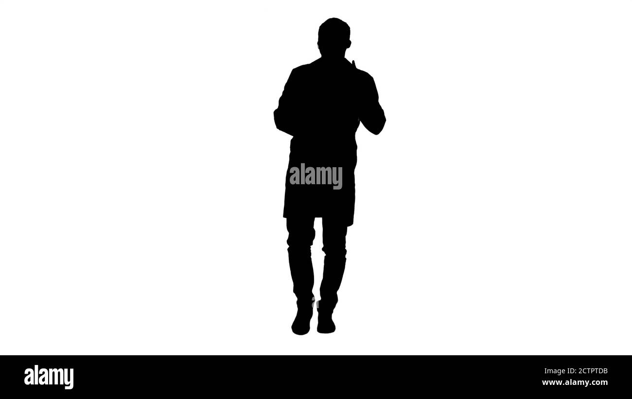 Silhouette Cheerful doctor walking, talking and looking into the Stock Photo