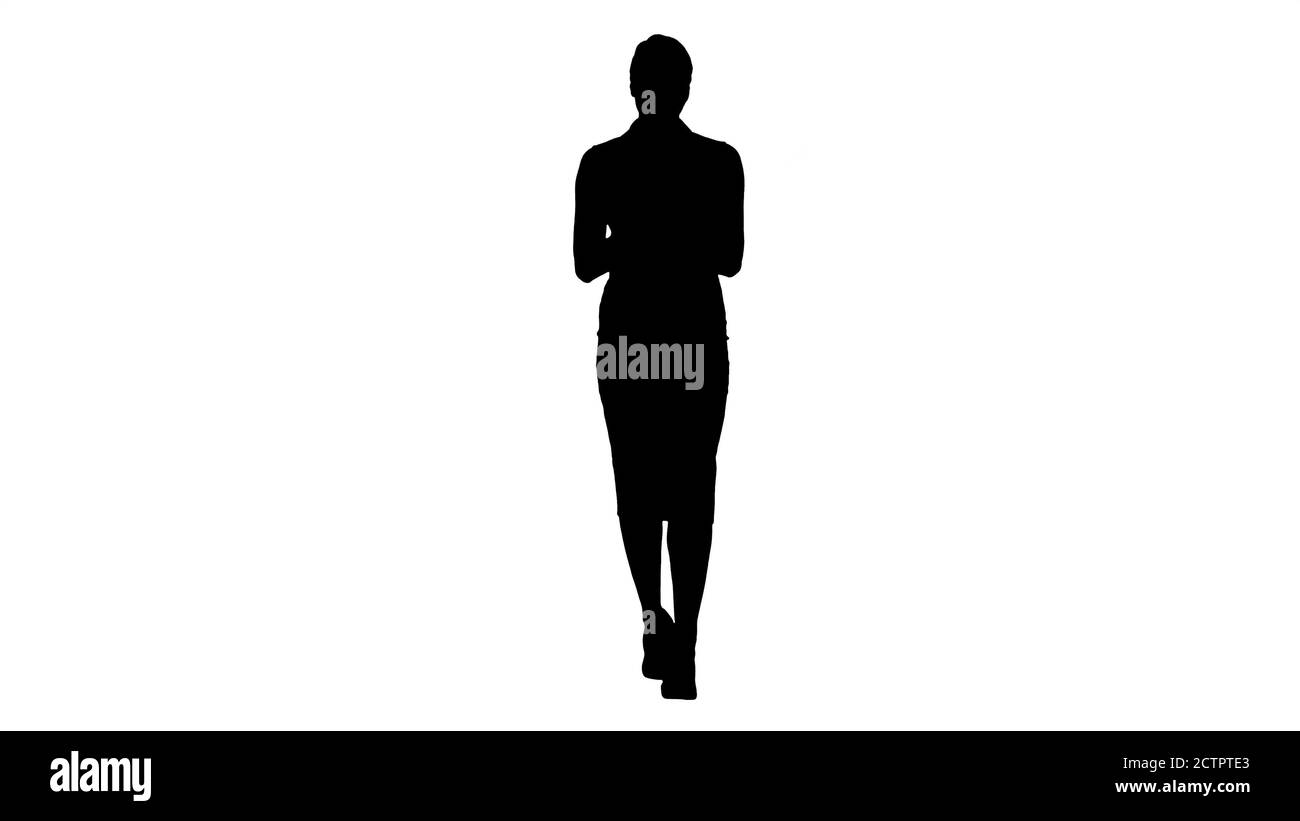 Silhouette Smiling businesswoman using electronic tab swiping an Stock Photo