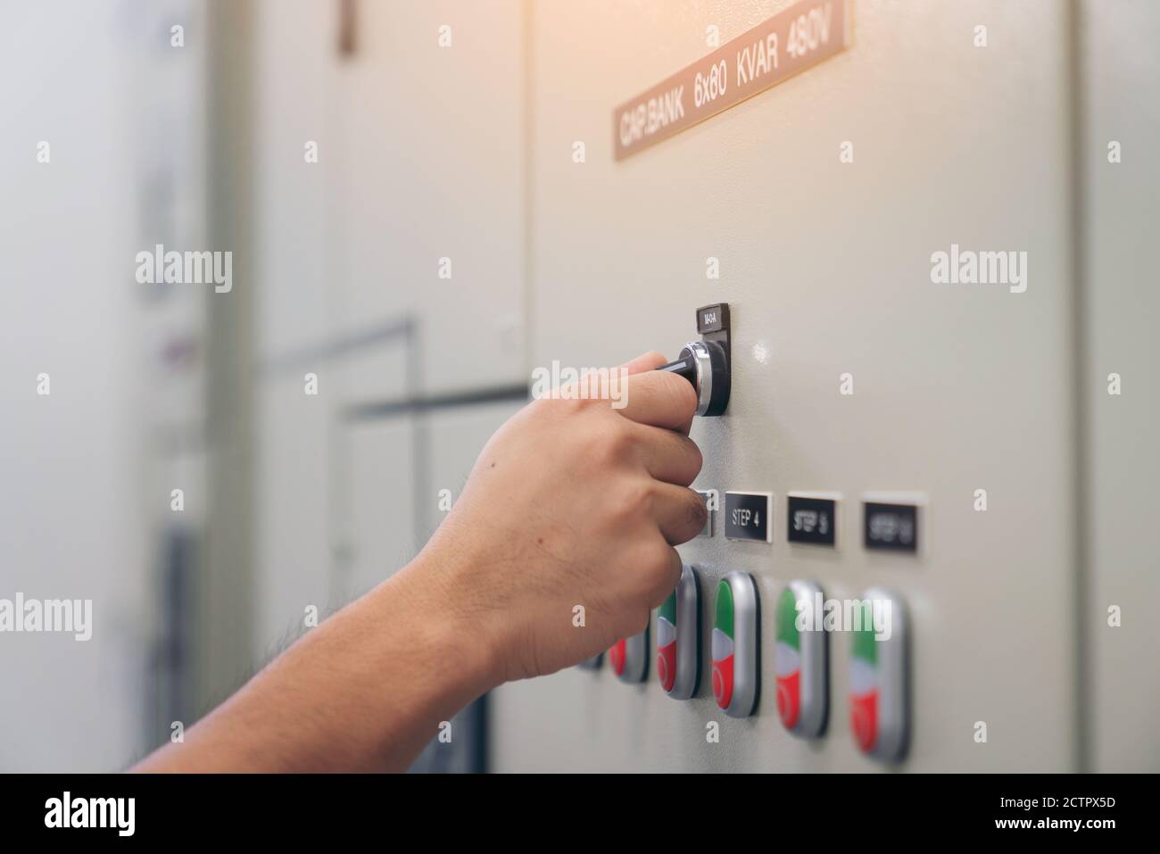 Electrical engineer man checking voltage and test at the Power