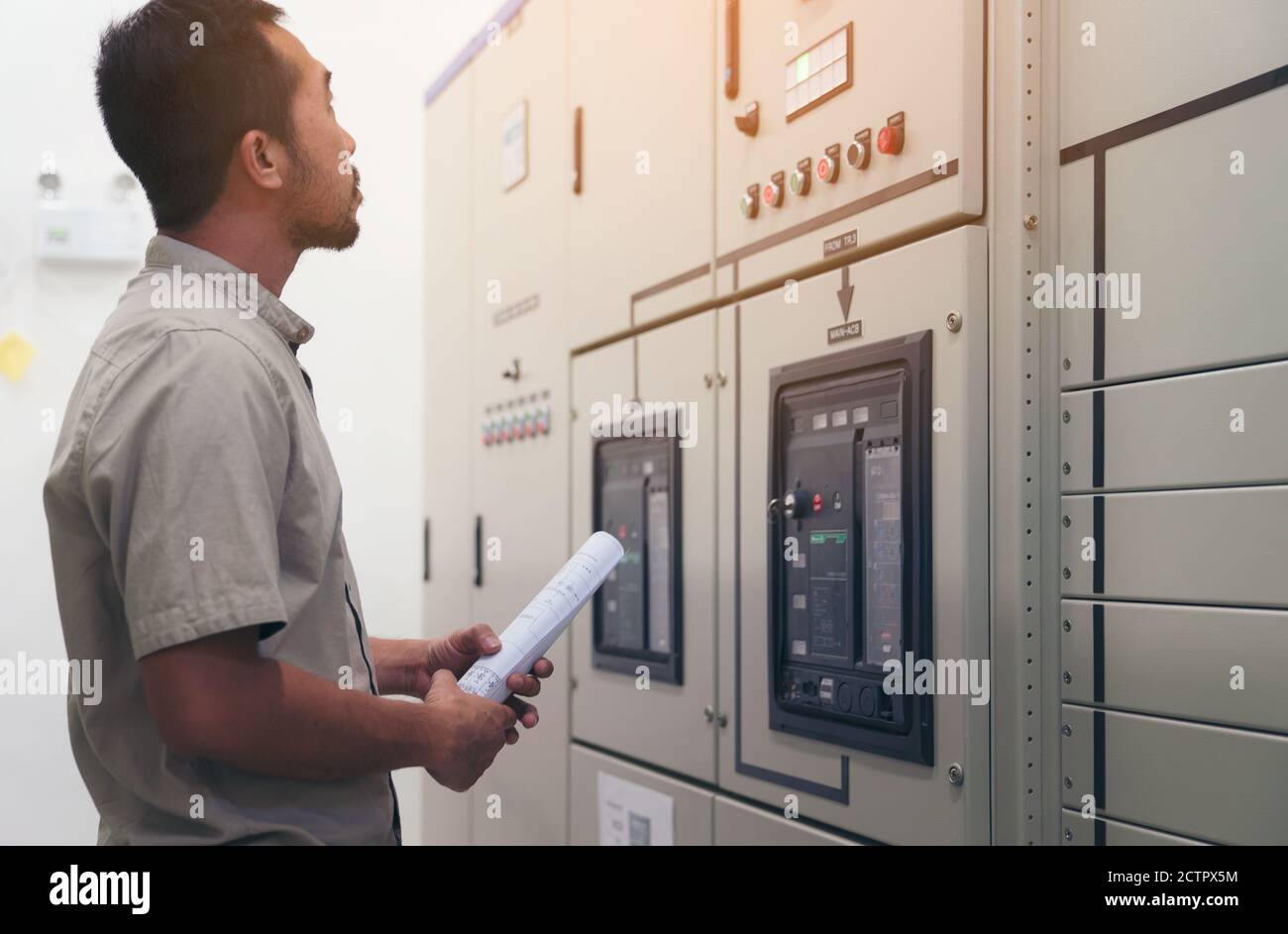 Electrical engineer man checking voltage and test at the Power