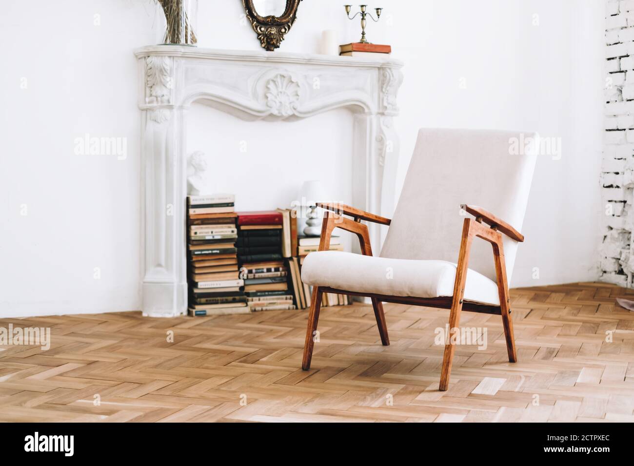 Interior design of stylish living room with vintage white armchair ...