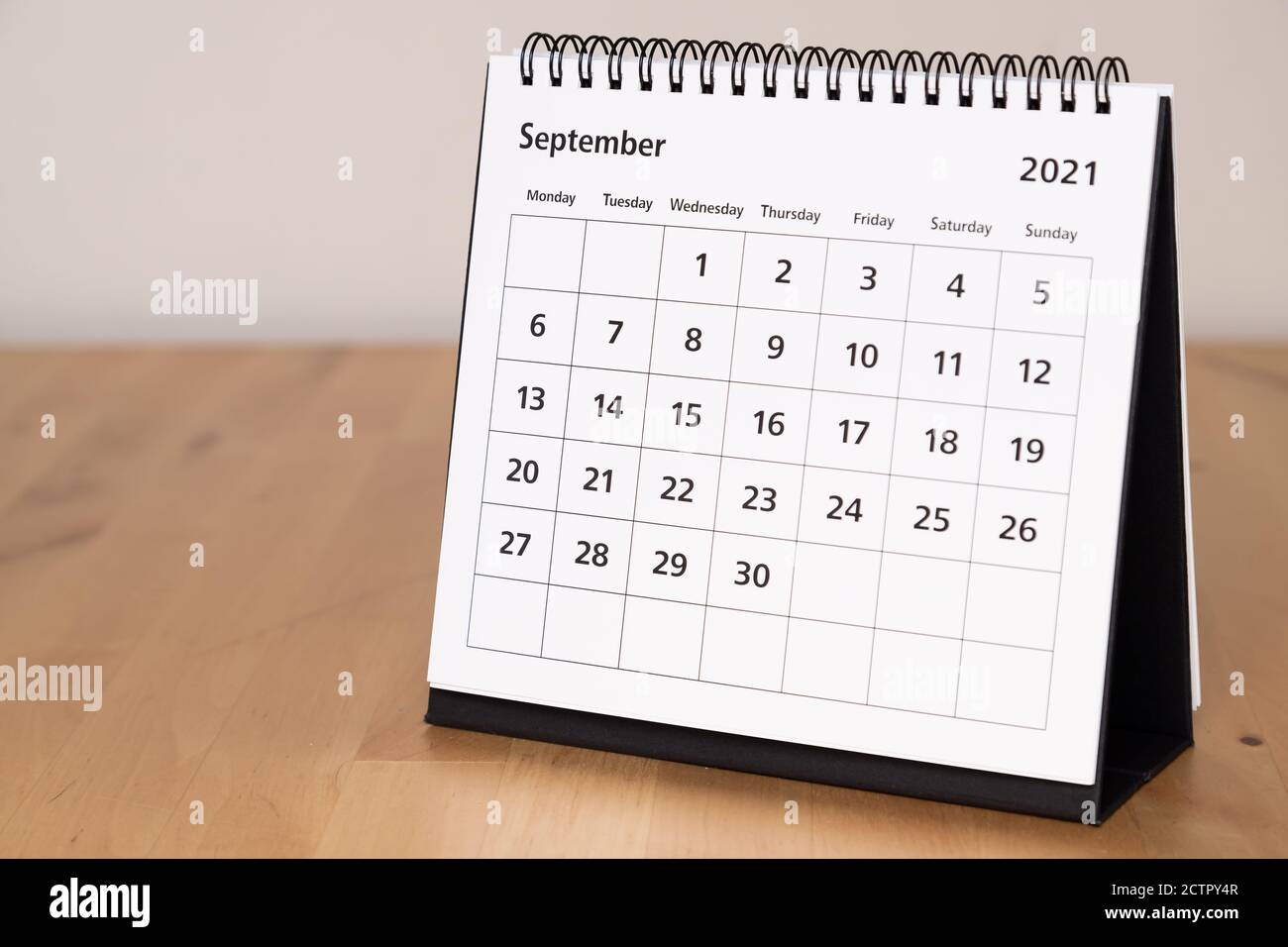 Month page: September in 2021 paper calendar on the wooden table Stock Photo