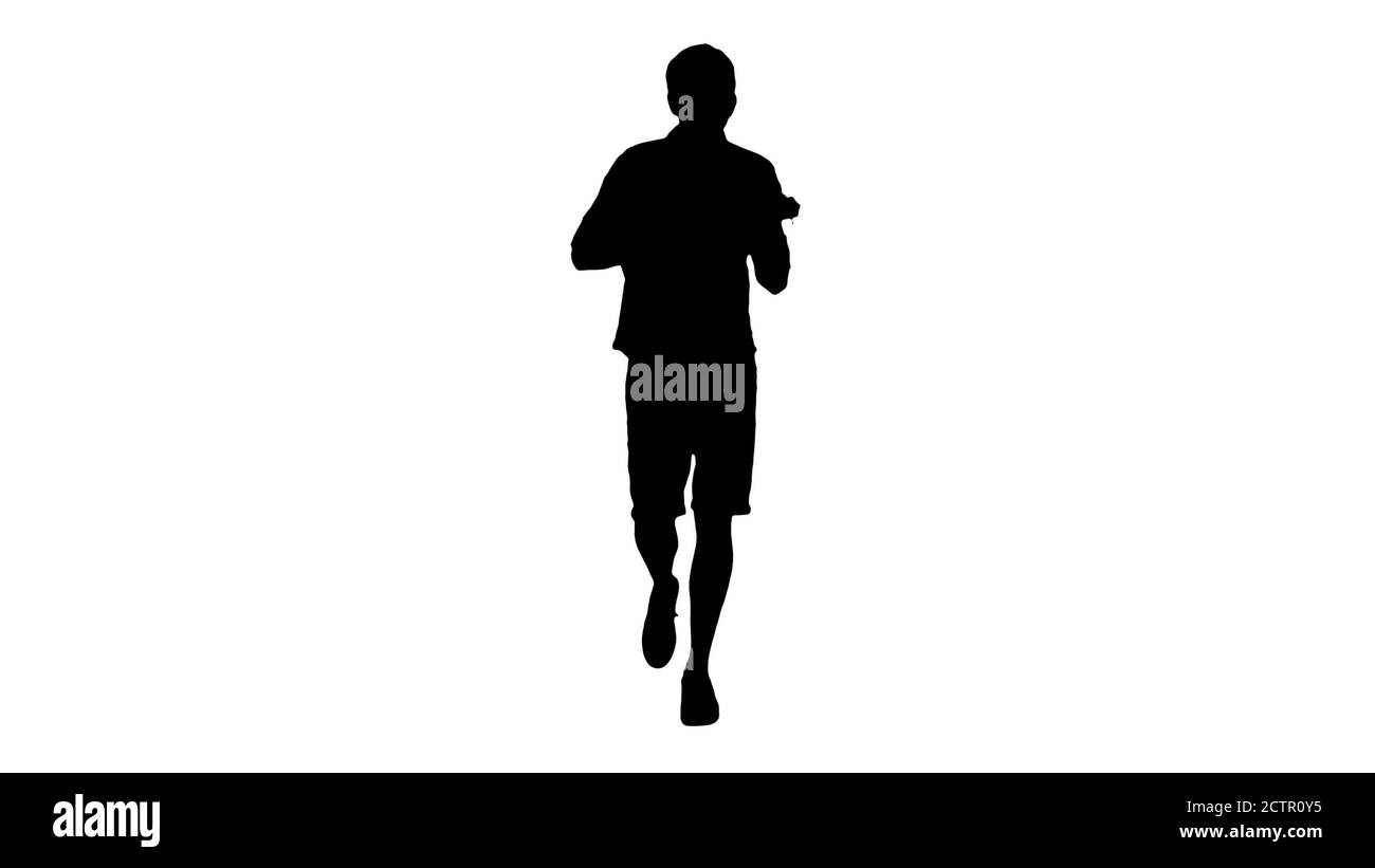 Silhouette Young man playing ukulele while walking. Stock Photo