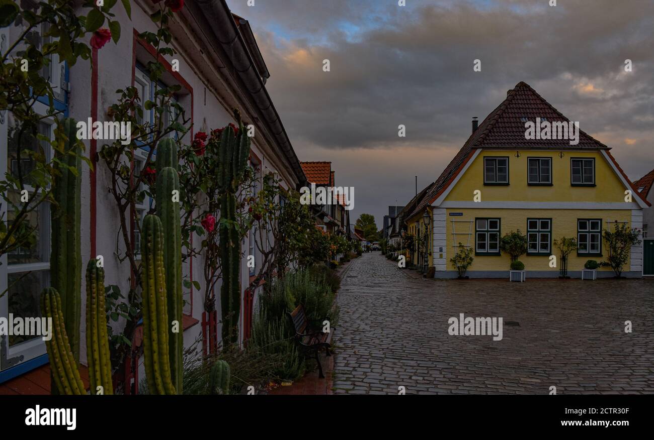 An empty street in Holm, Schleswig on a rainy day Stock Photo