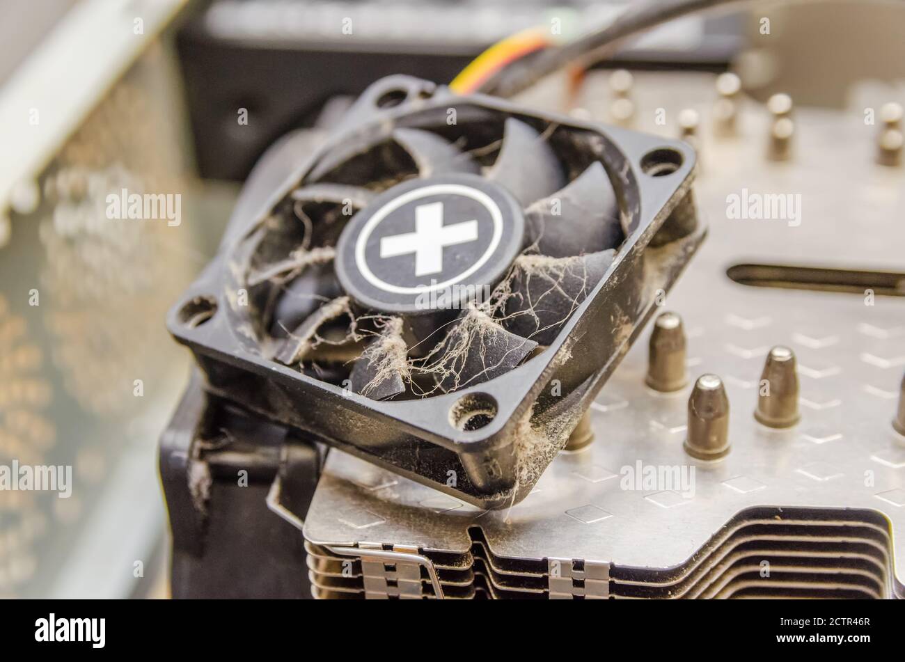Dust, dirt on the CPU cooler of the computer with a fragment of the