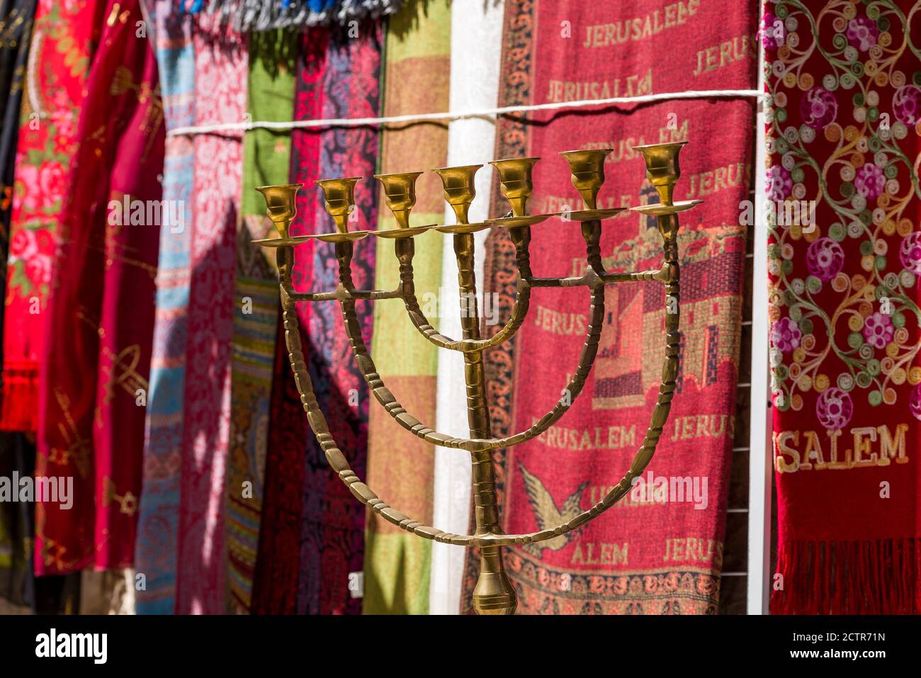 Israeli seven-branched candlestick against the background of the Carpets Jerusalem. Stock Photo
