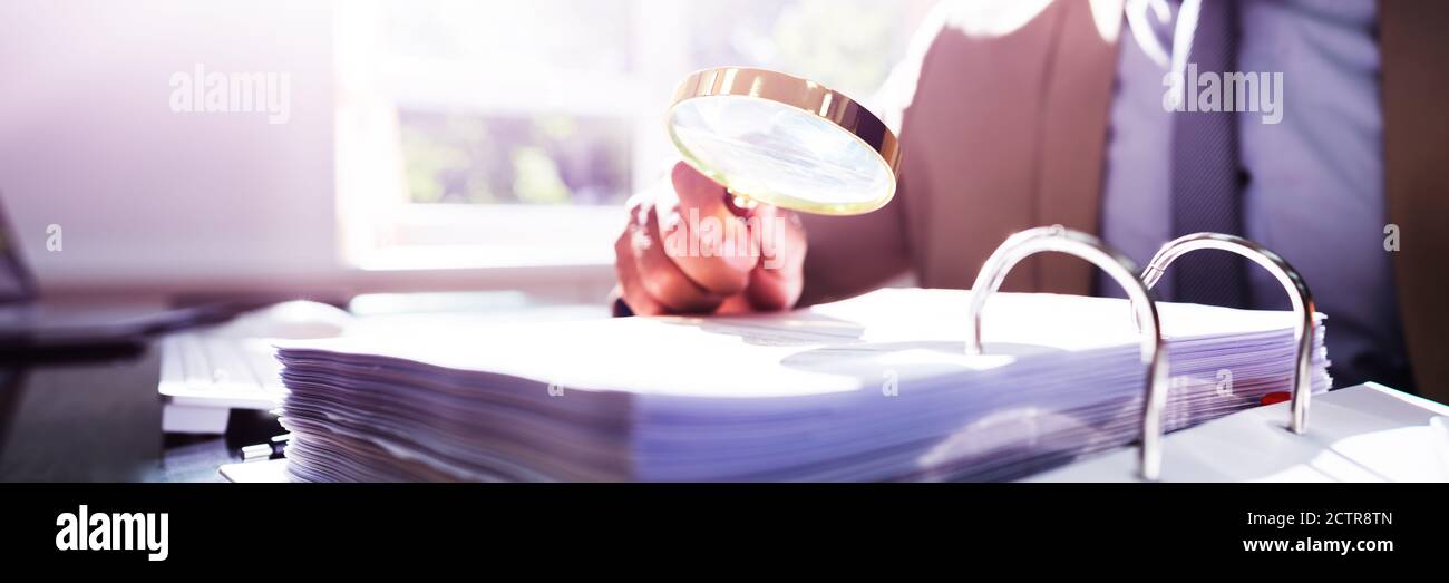 IRS Tax Audit. African Auditor Doing Debt Fraud Inspection Stock Photo ...