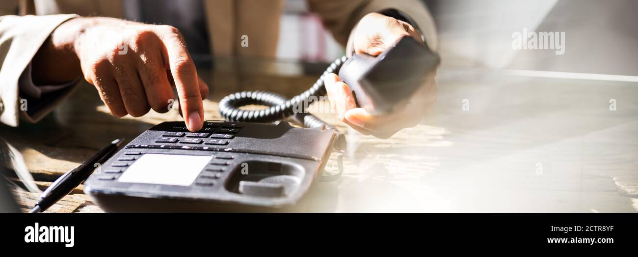 Landline Telephone Call In Office. Corporate Phone Stock Photo