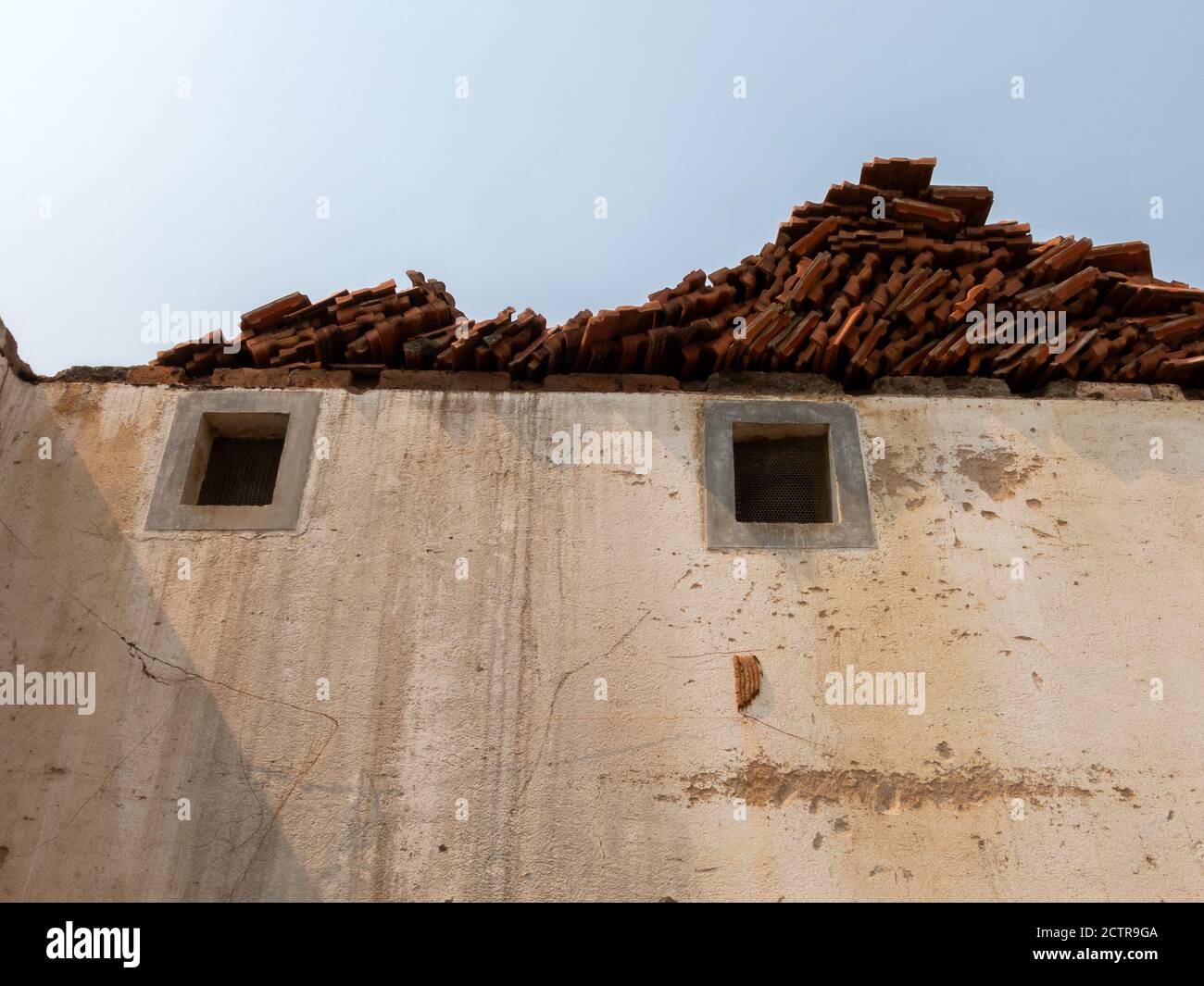 Pareidolia face house wall and windows Stock Photo