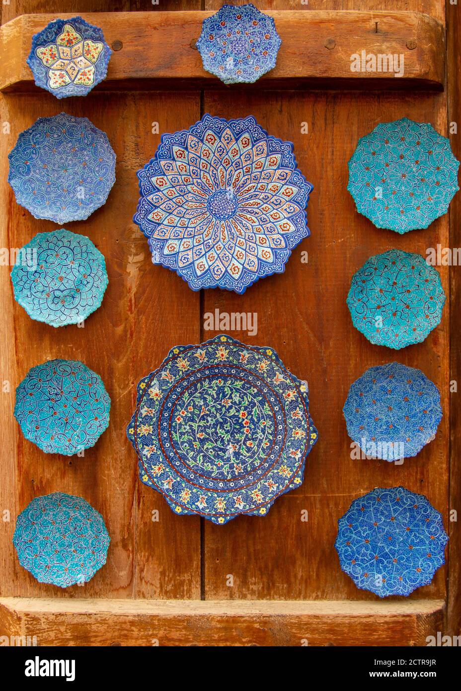 Plate vendor displaying his ceramic wares at one of the many souks in