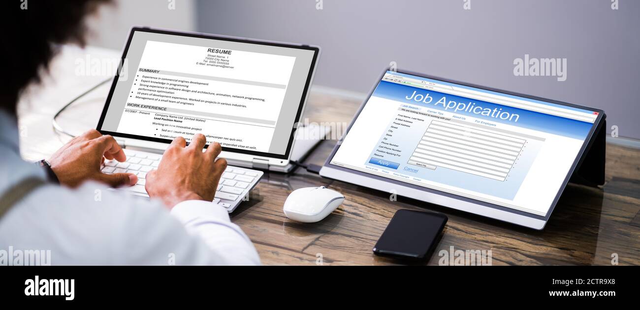 African Job Applicant Sending Resume Or CV Online Stock Photo