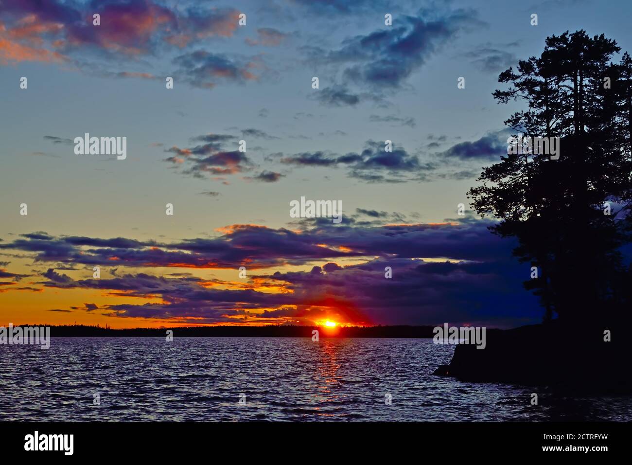 Last ray of the sun on lake Keret, Northern Karelia, Russia Stock Photo