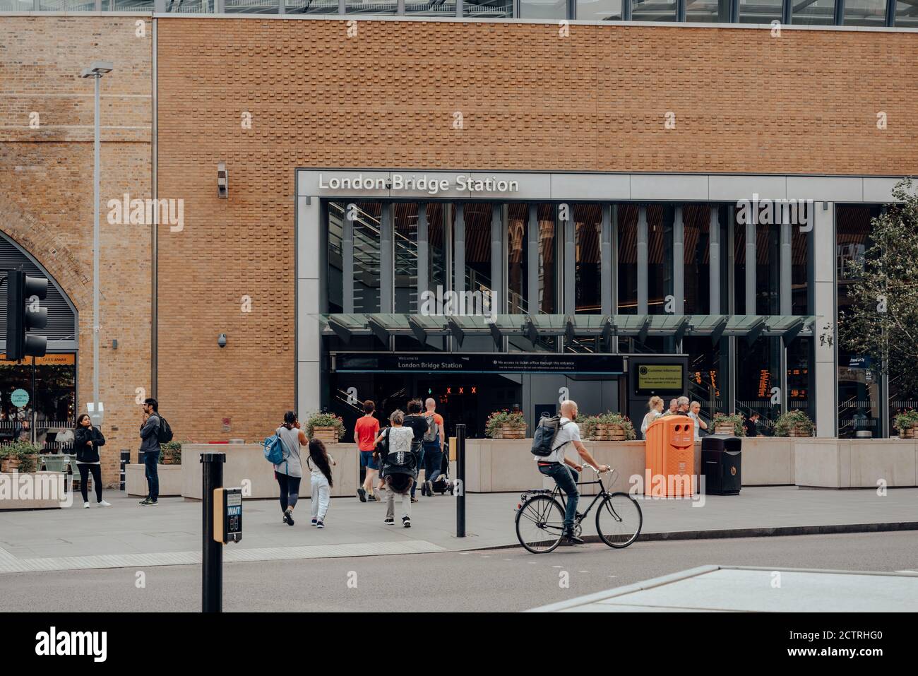 London Bridge Railing London, UK - August 25, 2020: Cyclist and pedestrian in front on London ...