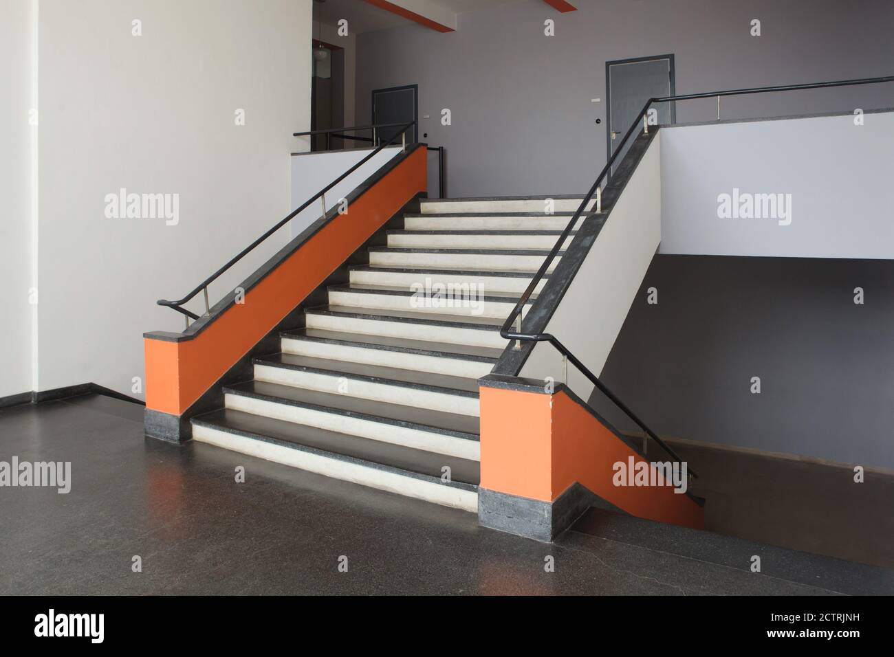 Staircase of the north wing of the Bauhaus Building designed by German modernist architect Walter Gropius (1925-1926) in Dessau in Saxony-Anhalt, Germany. Stock Photo