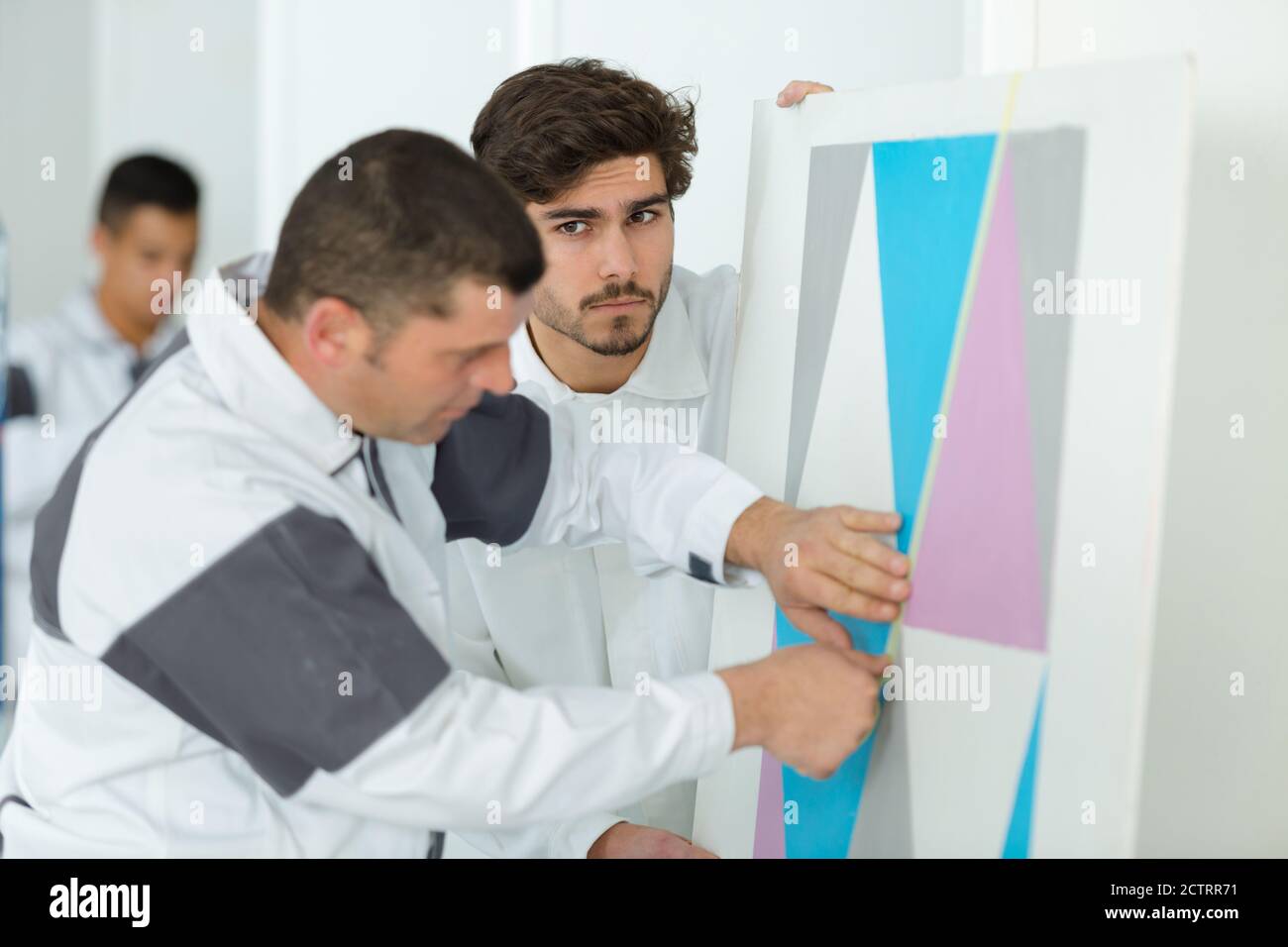 young apprentice painter in professional training Stock Photo