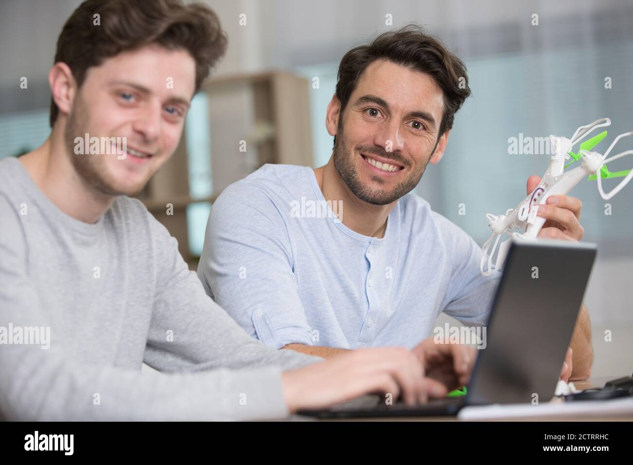 cute boy and his father playing with drone at home Stock Photo - Alamy