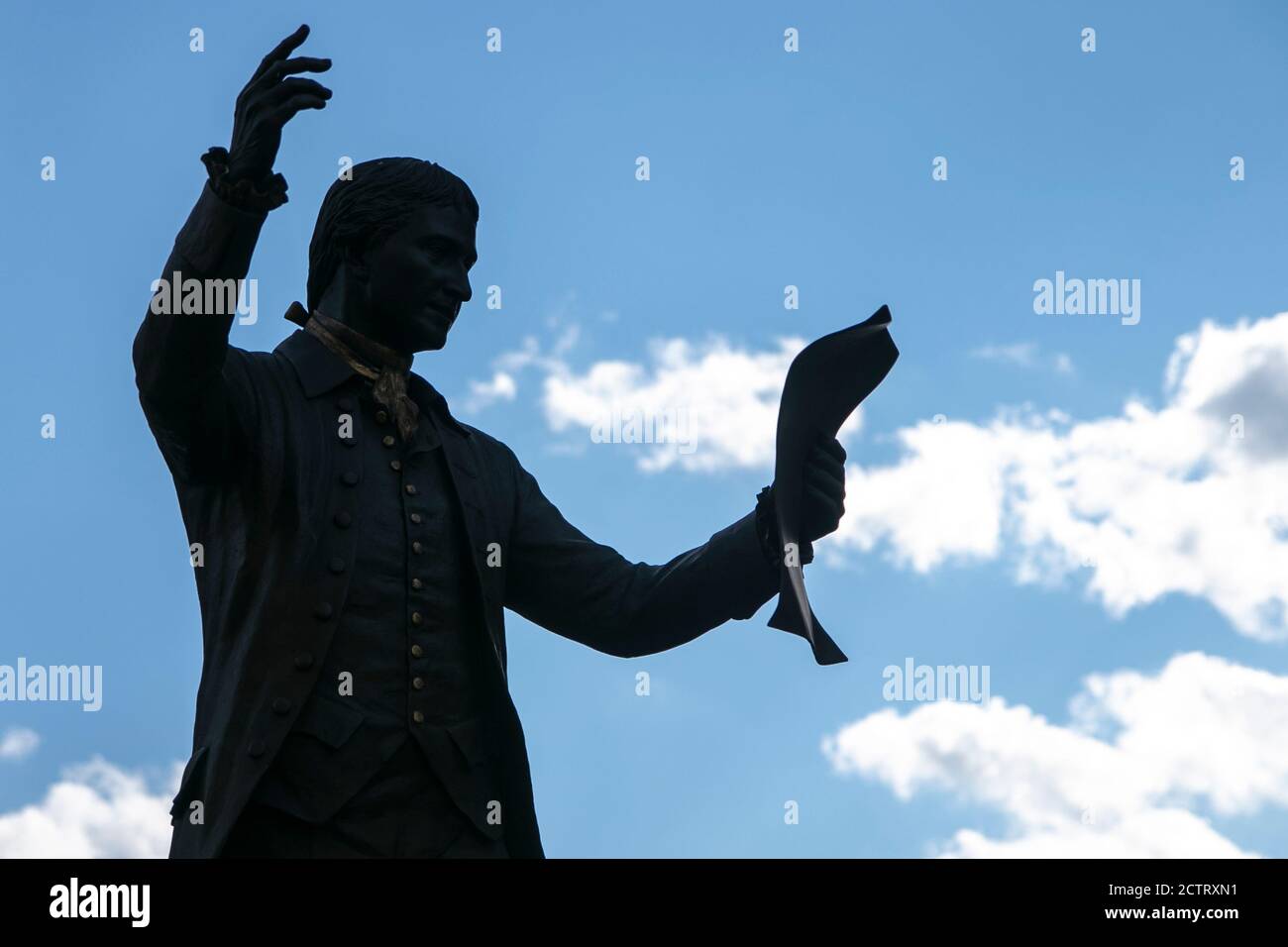 Silhouette of tall bronze statue, depicting the historic public reading of the Declaration of Independence by Colonel John Neilson on July 9, 1776. Stock Photo