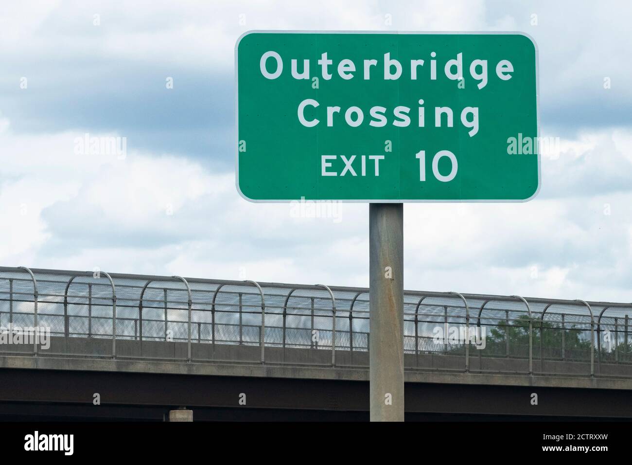 Directional street sign "Outerbridge Crossing EXIT 10" directing