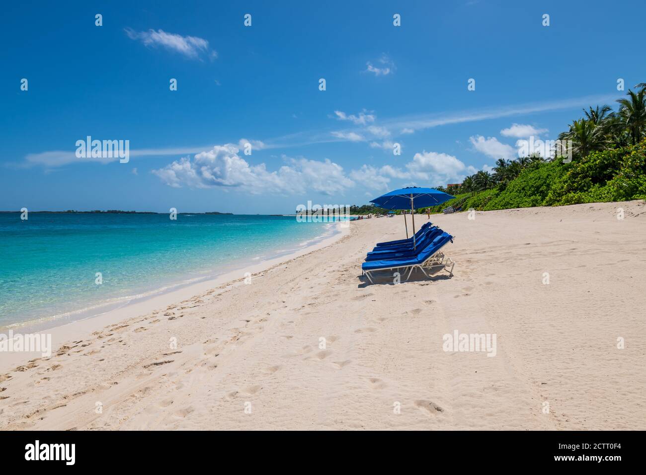 View of Cabbage beach in Paradise Island with sunbeds and umbrellas