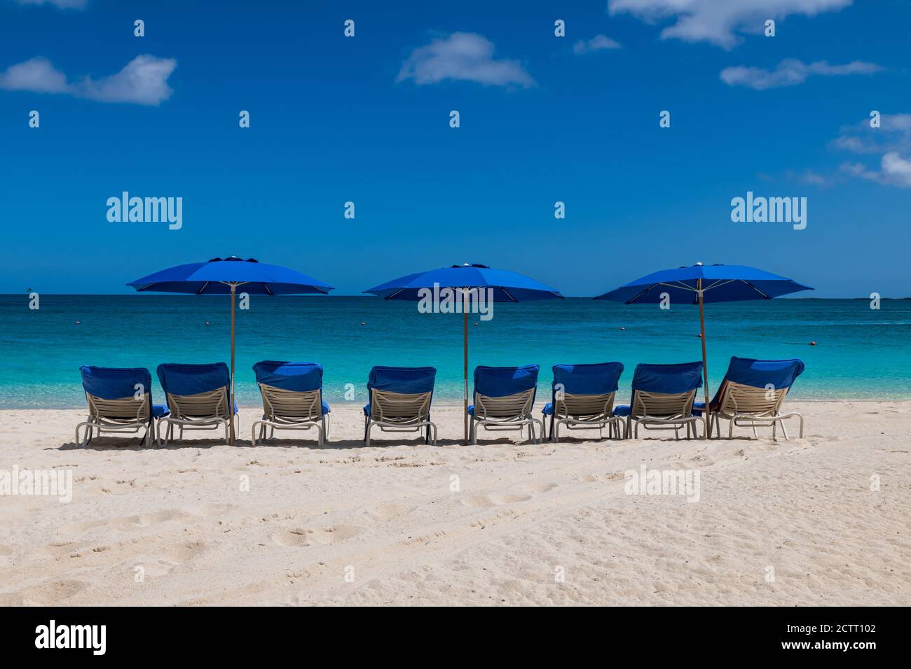 View of Cabbage beach in Paradise Island with sunbeds and umbrellas