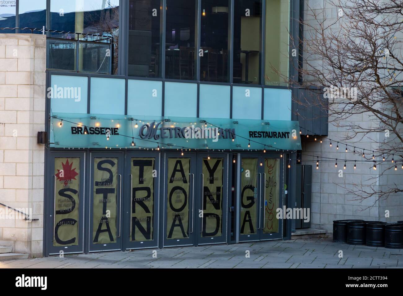 In May 2020, a message in the doors of the Metropolitan restaurant in downtown Ottawa during the COVID-19 pandemic says 'Stay Strong Canada'. Stock Photo